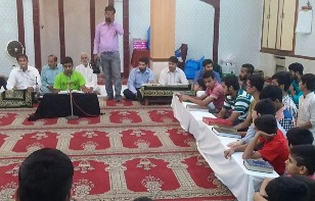A teacher leads a recitation class